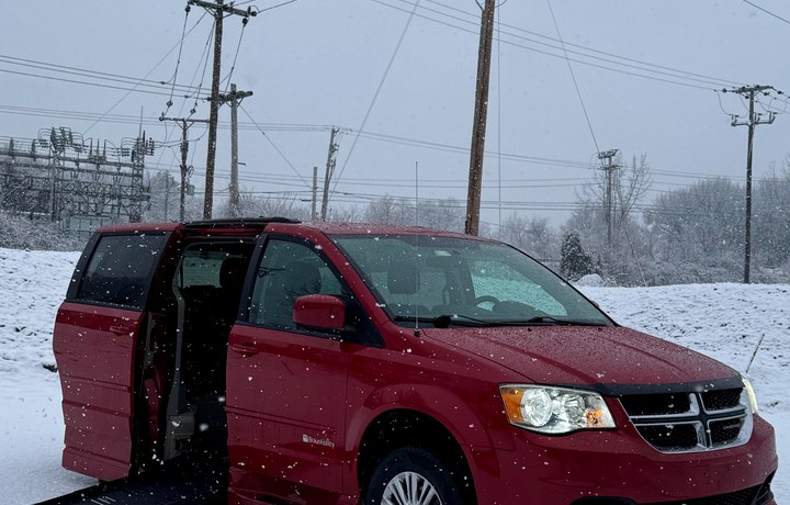 Red Dodge Grand Caravan wheelchair ramp deployed